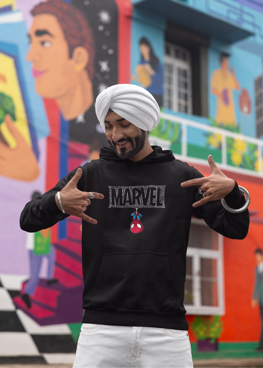 Person wearing a Marvel hoodie in front of a colorful mural