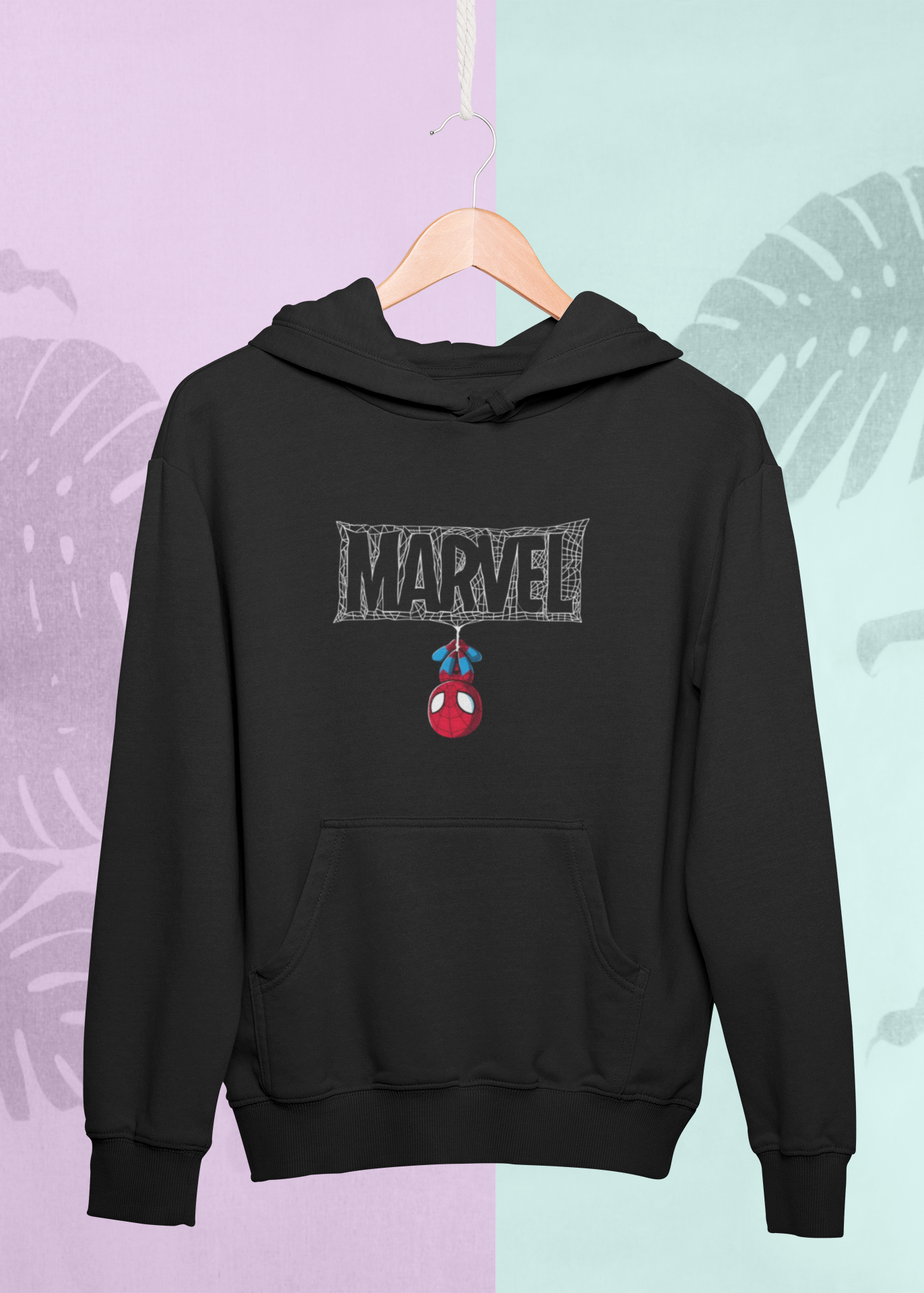 Black hoodie with Marvel logo and Spider-Man emblem on a hanger against a multicolored leaf-patterned background